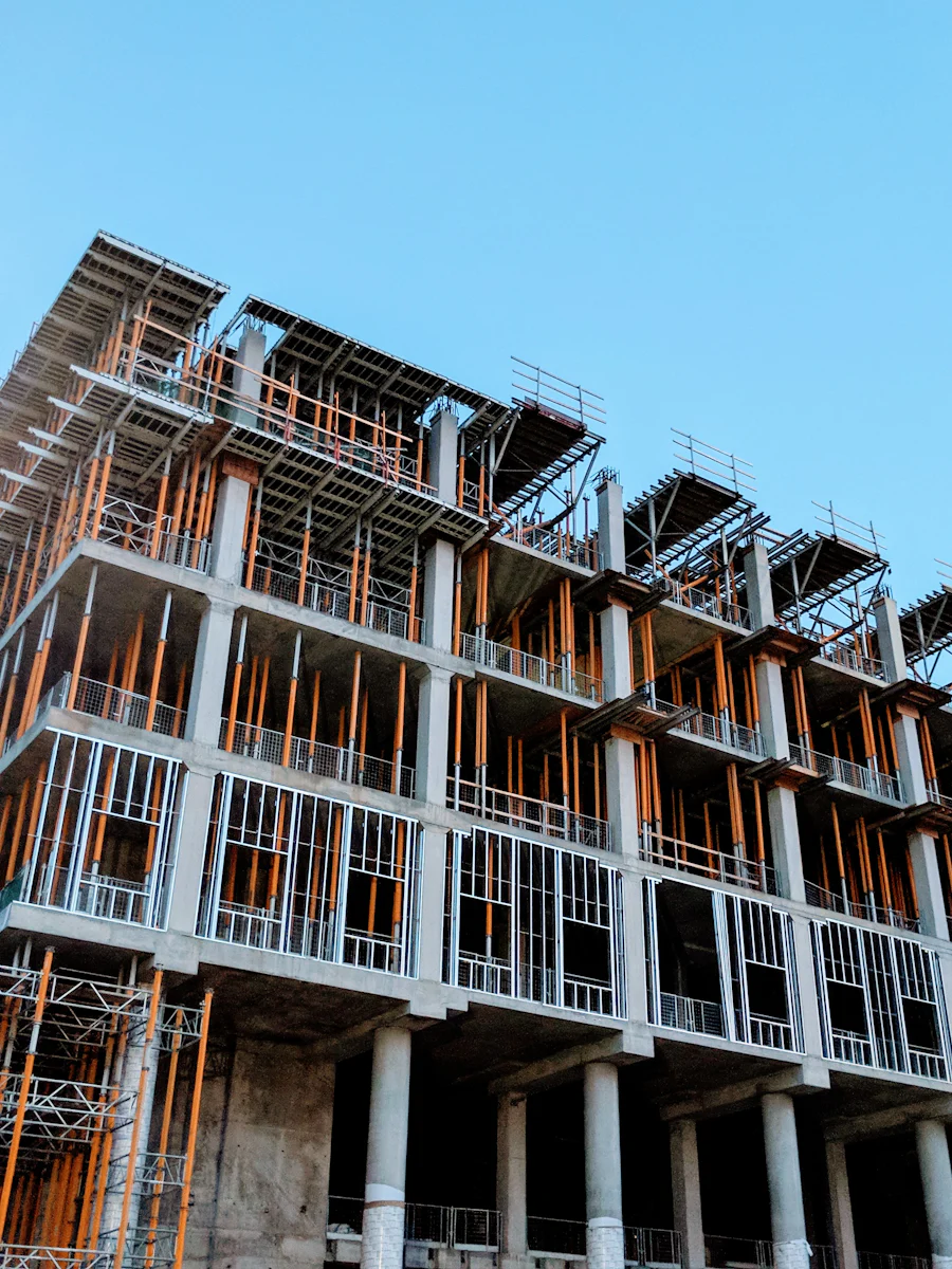 Concrete building under construction with the structural frame still exposed.
